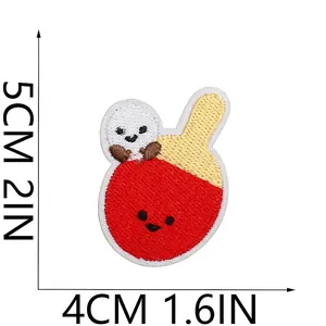 Detailed view of a cartoon table tennis paddle embroidered patch with dimensions
