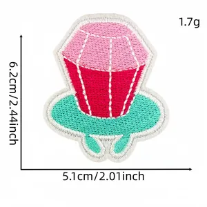 Macro view showing dimensions of a colorful cartoon gem ring embroidery patch for DIY clothing