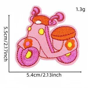 Detail view of pink cartoon scooter embroidery patch with dimensions 5.5 x 5.4 cm
