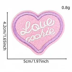 Detail view showing 5cm x 4.2cm dimensions of pink heart Love embroidered patch