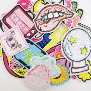 Close-up detail of various colorful cartoon embroidered DIY iron-on patches for clothing