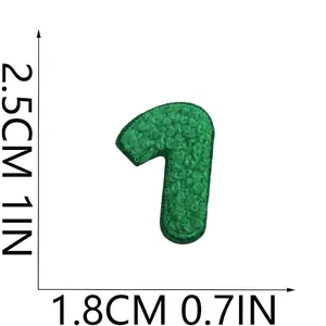 Macro detail of green chenille embroidered letter patch with size 2.5cm by 1.8cm