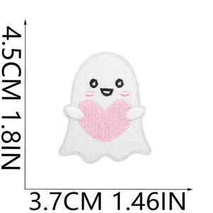 Detailed view of a cute white ghost embroidery patch holding a pink heart design