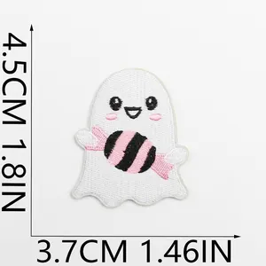 Macro view of cute Halloween ghost embroidery patch with candy, measuring 4.5cm by 3.7cm