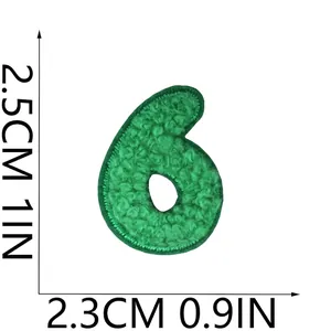 Close-up detail of a green chenille number 6 embroidered patch with clear dimension markings