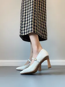 Vintage French Mary Jane pumps with white leather finish and chunky wood heel
