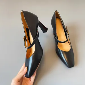 Close-up of elegant black leather Mary Jane heels with vintage square toe design