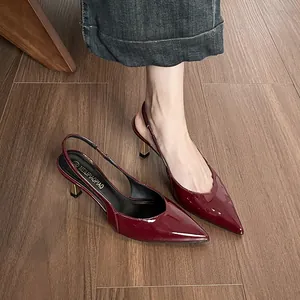 Elegant burgundy patent leather slingback sandals with pointed toe and unique stiletto heels