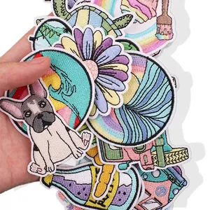 Close-up of colorful summer-themed embroidered patches showing detailed stitching texture.