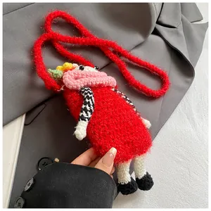 Handmade crochet crossbody bag featuring a quirky big mouth red character design in detail