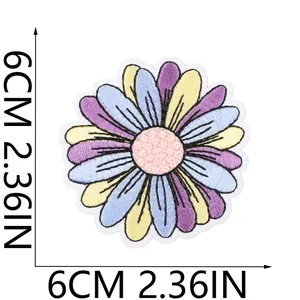 Detailed scale view showing the 6cm / 2.36in size of the colorful daisy flower patch