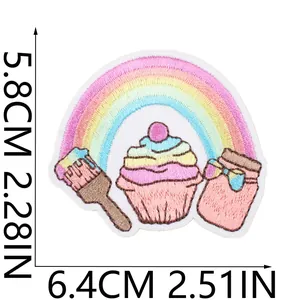 Detailed close-up of embroidered rainbow cupcake patch with 5.8x6.4cm dimensions