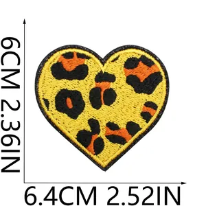 Detail view of heart-shaped leopard print embroidery patch with dimensions 6.4cm x 6cm