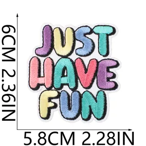 Close-up detail of colorful JUST HAVE FUN embroidered text patch with dimensions