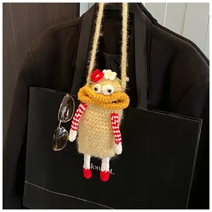 Detailed view of handmade crochet crossbody bag with funny big mouth design