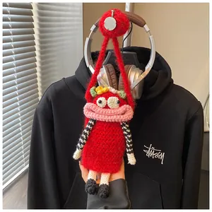 Detailed shot of a red handmade funny big mouth crochet crossbody bag for women