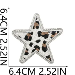 Macro view of leopard star patch showing 6.4cm dimension and glitter border
