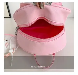 Detailed interior view of pink PU cartoon backpack for kids showing inner lining