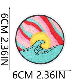 Close-up detail of a 6cm round embroidered patch with an artistic wave and sun design