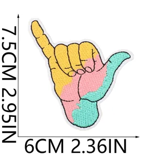 Detailed size view of colorful Shaka hand gesture embroidered patch for summer themes.