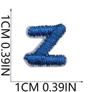 Detailed macro view of a blue embroidered letter Z patch showing 1cm square dimensions