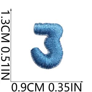Macro detail view of mini blue embroidered number 3 patch with clear size measurements