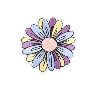 Colorful daisy flower embroidery patch with pastel petals on white background