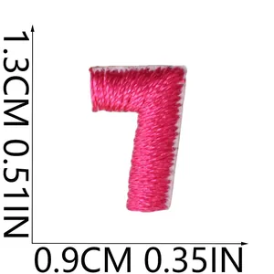 Close-up detail showing 1.3cm height measurements for pink embroidered number 7 patch