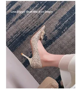 Side view of elegant champagne glitter high heels with rhinestone buckle on foot