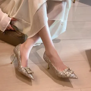 Elegant champagne sequin stiletto heels featuring a crystal buckle for bridal wedding wear