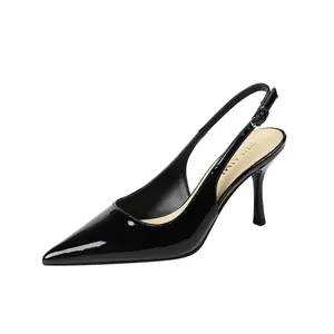 Elegant black patent leather slingback high heels with pointed toe and stiletto heel.