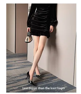 Elegant pointed-toe patent leather stilettos with sparkling rhinestone flower detail