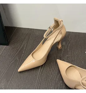 Elegant beige patent leather pointed toe high heels with adjustable ankle straps