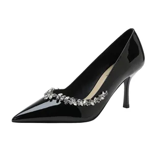 Elegant black patent leather pointed toe pumps with rhinestone embellishments for weddings
