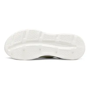 Detailed view of white anti-slip shoe outsole featuring a hexagonal traction pattern