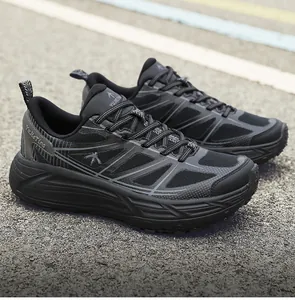 Detailed view of breathable black YuJieTing sports sneakers with thick shock-absorbing soles.