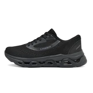 Side profile detail showing the breathable mesh and hollow sole of black running shoes