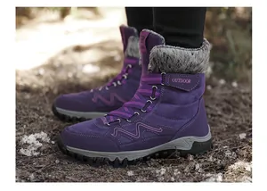 Detailed side view of purple winter hiking boots featuring a warm plush faux fur lining