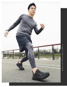 Man running outdoors wearing breathable black athletic shoes and grey sports leggings