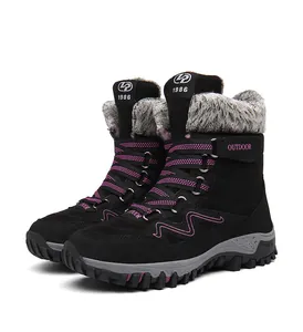 Side view of black outdoor snow boots with warm fur lining and pink accents
