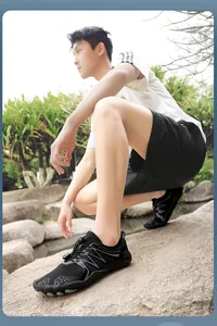 Macro detail of men's black quick-dry water shoes for outdoor hiking and wading