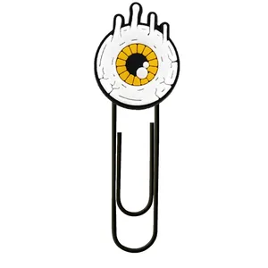 Close-up detail of a creative evil eye cartoon bookmark paperclip for office use