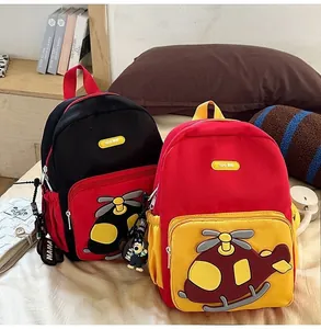 Two colorful children's backpacks with cartoon helicopter design for preschool kids