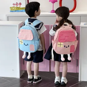 Linda mochila escolar de estilo casa de dibujos animados para niños en azul y rosa
