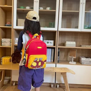 Cute cartoon helicopter backpack for kindergarten kids, red and yellow, lightweight design