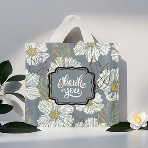 Detailansicht der grauen Geschenktüte mit Blumenmuster und 'Thank You' Aufdruck