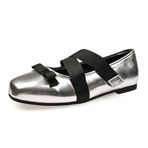 Silver ballet-style Mary Jane flats with black cross straps and bow for wide feet
