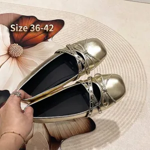 Gold metallic wide fit Mary Jane ballet flats with bow and cross strap details