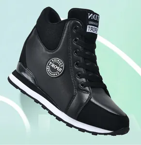 Detailed view of black women's hidden wedge sneakers with a stylish lace-up design.