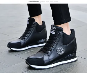 Side view of fashionable black high-top wedge sneakers for women with white soles